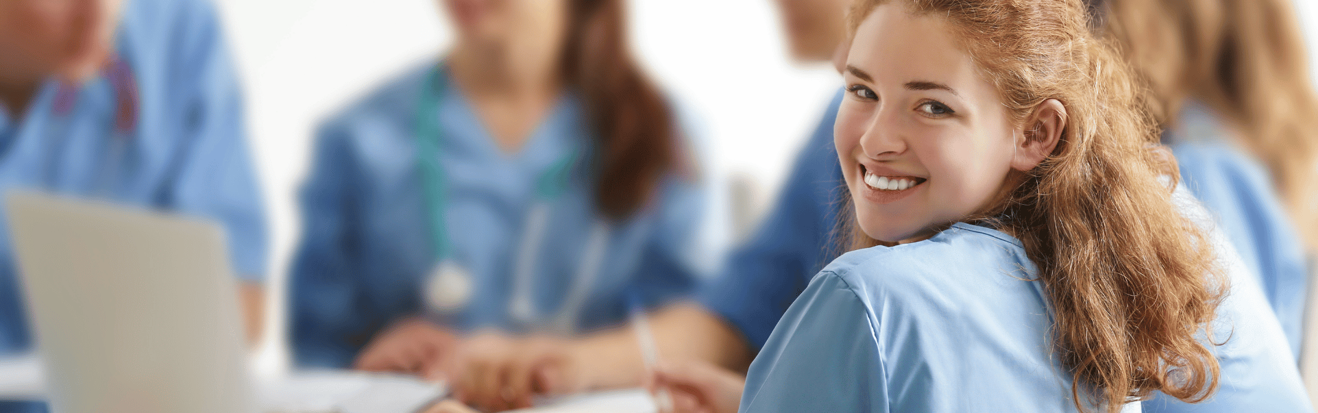 a picture of a nurse smiling in a clinical trial centre 