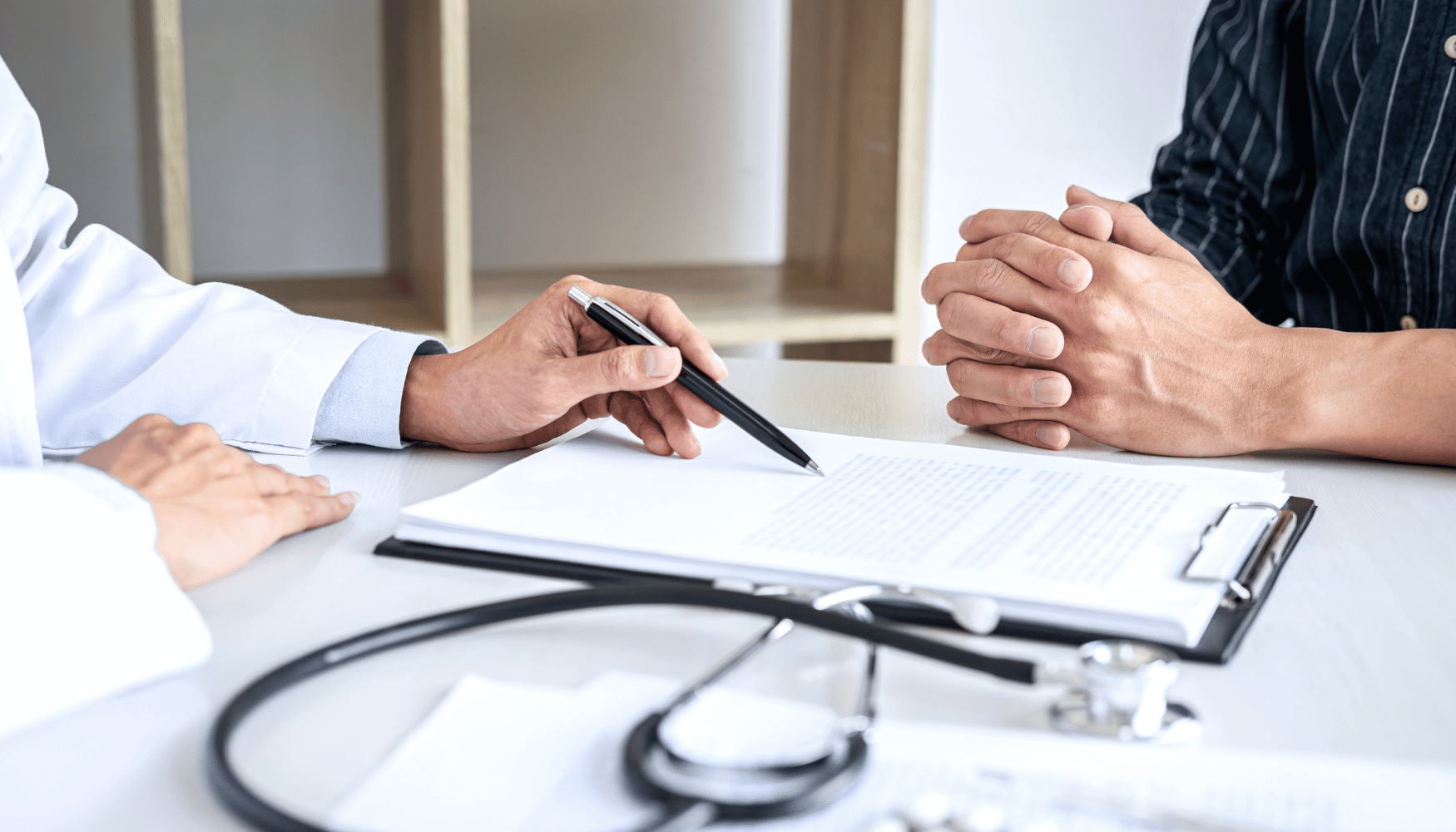 Doctor discussing clinical trial participation with a volunteer in a healthcare setting